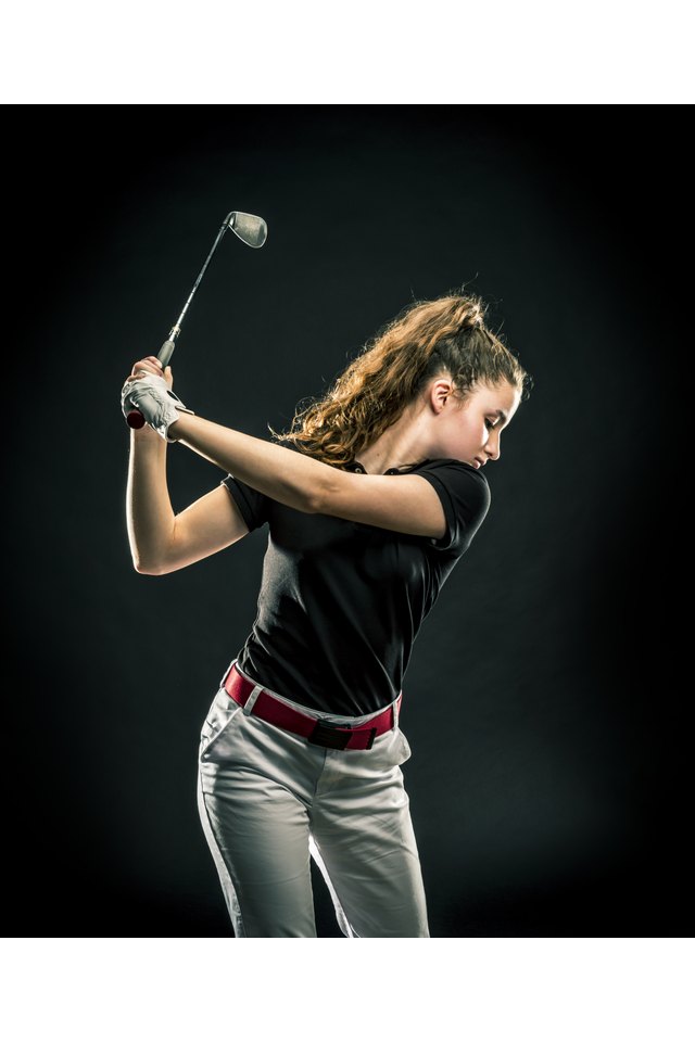 Close-up of a girl playing golf