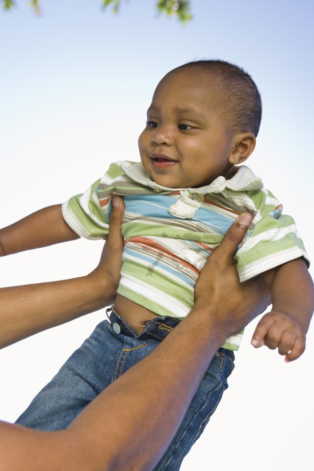 Hands holding baby