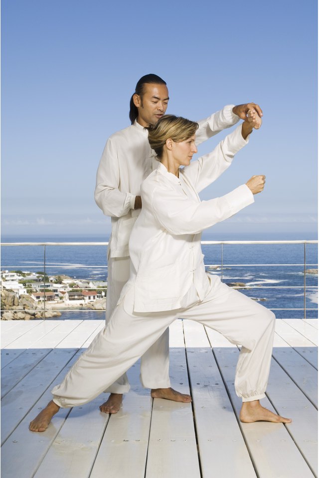 Man and woman practicing Tai Chi