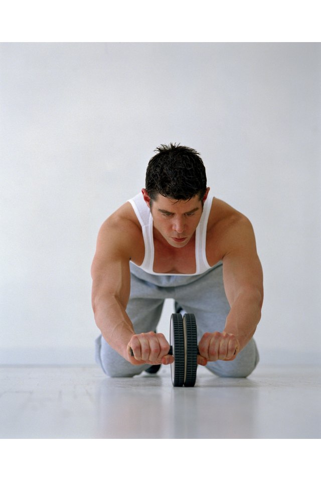 Man with an exercise wheel