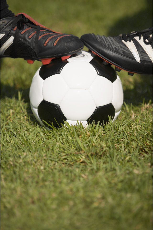 Soccer cleats on ball