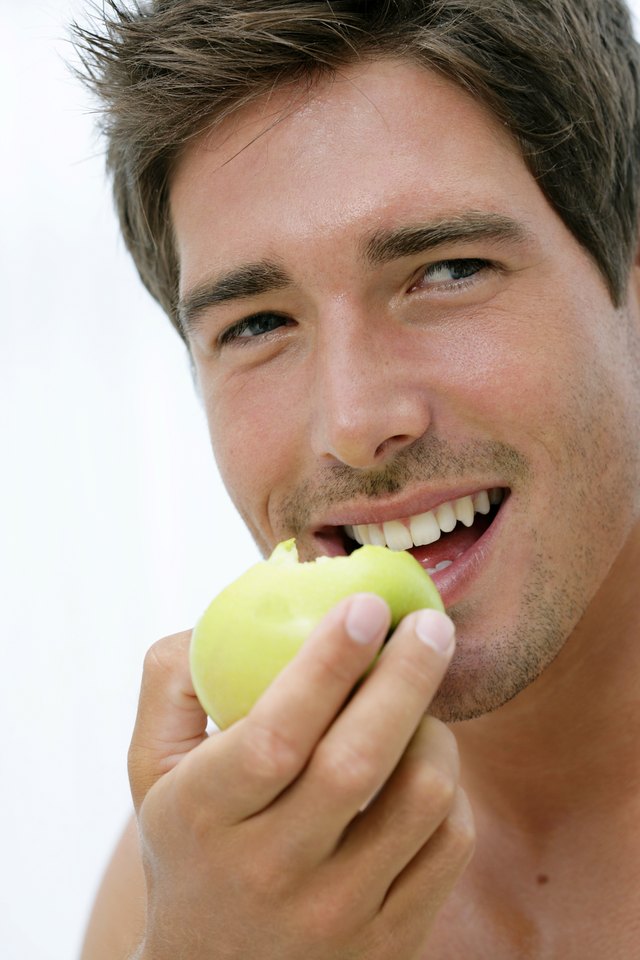 Man eating apple