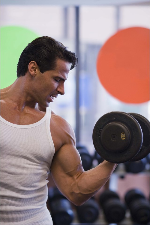 Man lifting weights at gym