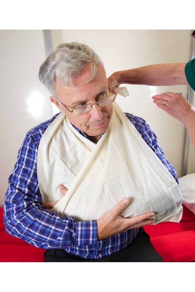 Patient being attended to by paramedic nurse for injured arm