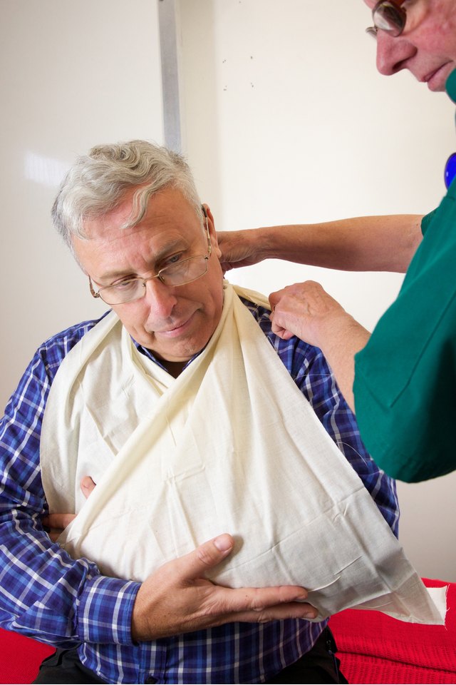Patient being attended to by paramedic nurse for injured arm
