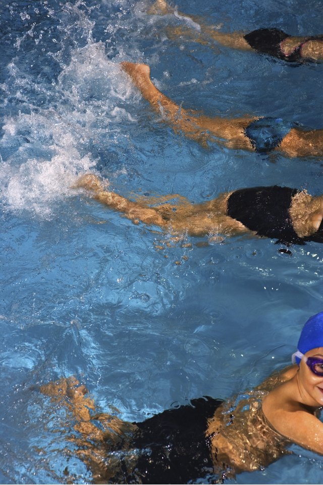 Swim team practicing kicking