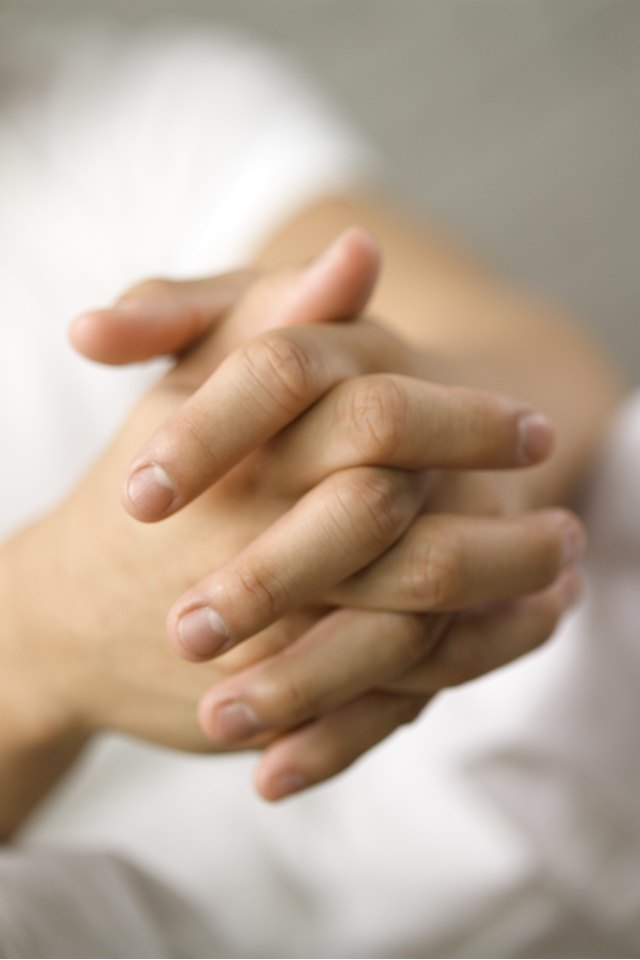 Fingers interlocked, close-up