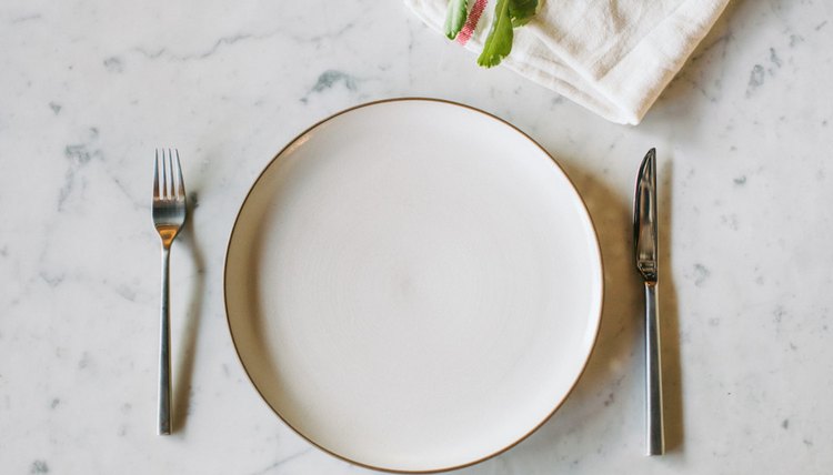 empty plate next to plant