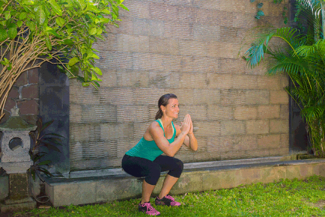 Woman celebrating fitness workout success