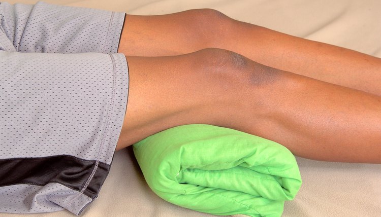 image of a towel underneath a resting man's knees