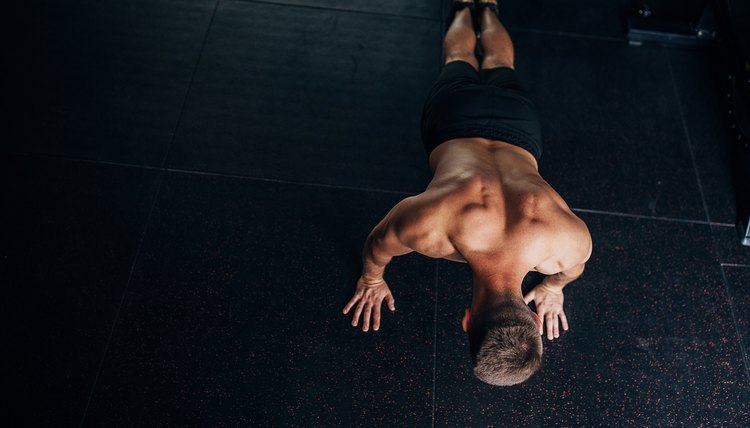 Shirtless man doing push-ups