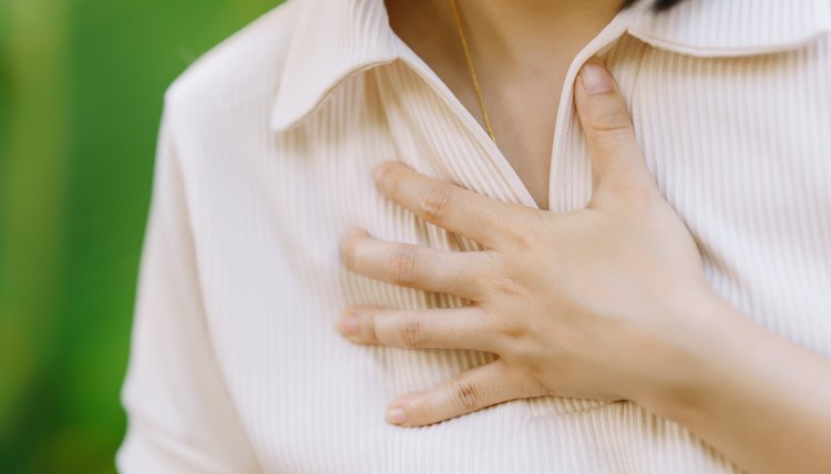 Women experience chest congestion due to suffocation. Health care concept.