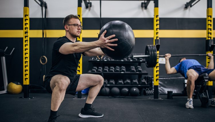 Man training with medicine ball