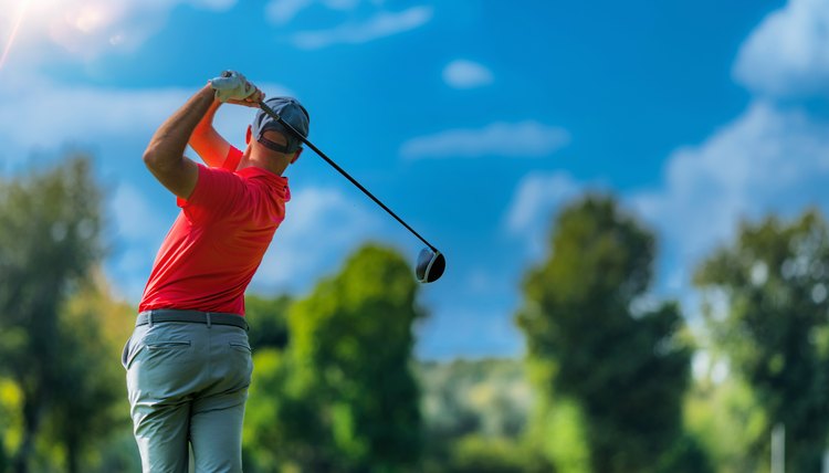 Playing golf, beautiful day, blue sky background