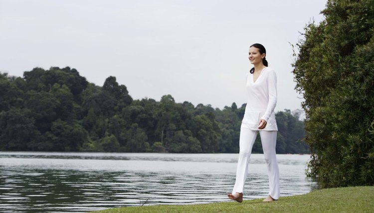 Woman walking by lake