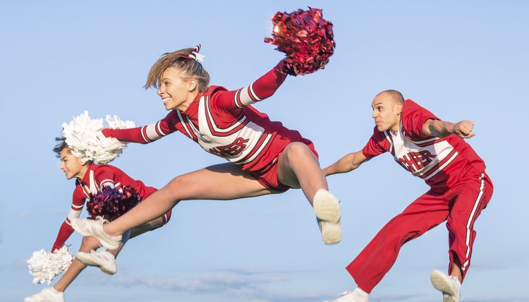Cheerleaders team with male Coach