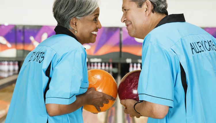 Two friends on bowling league about to bowl
