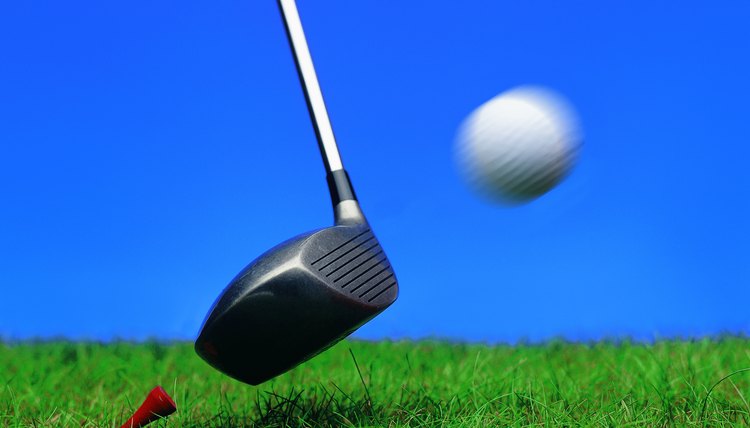 close-up of a golf ball as its hit by a golf club