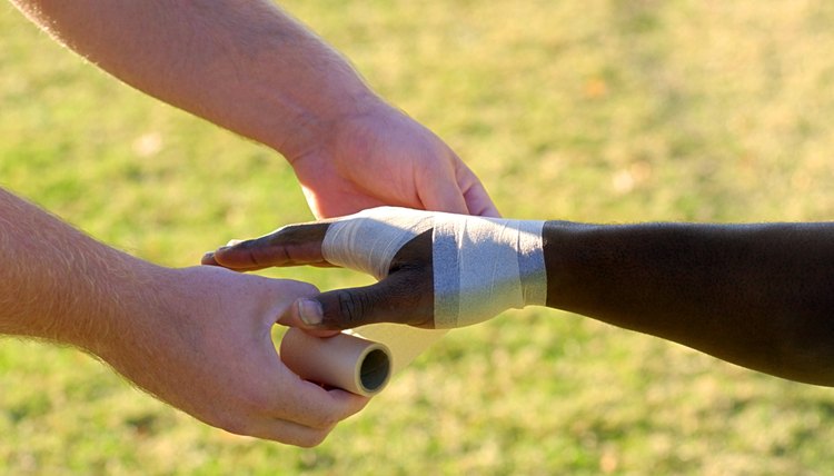 Man wrapping players hand