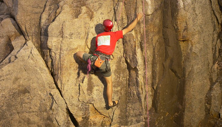 Person scaling rocks