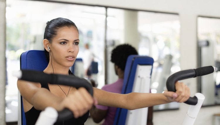 Sport people training and working out in fitness club