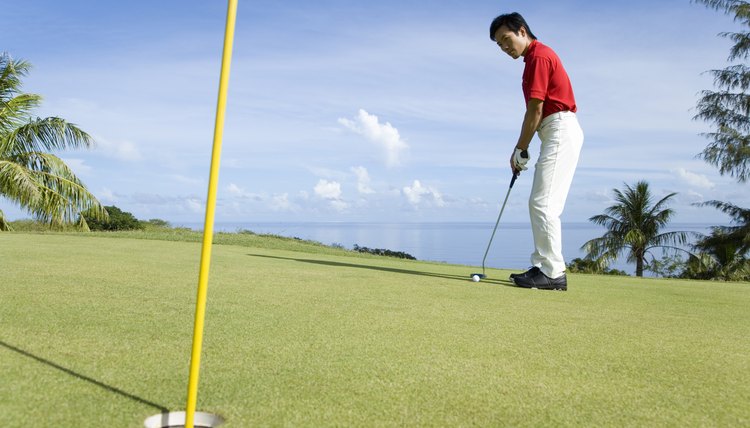 Man putting ball, Saipan, USA 