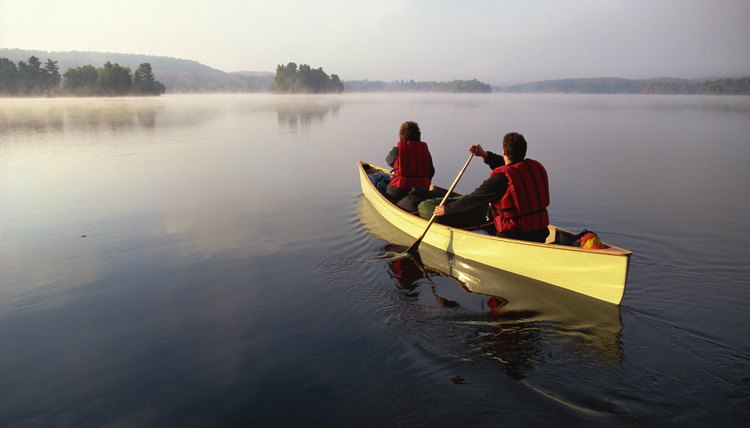 People canoeing on lake