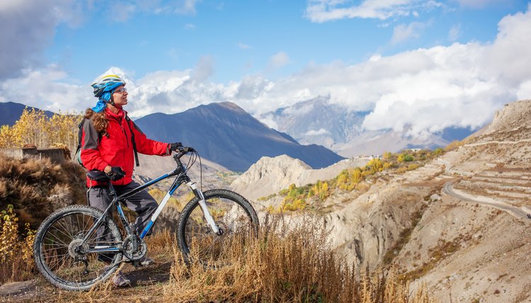 Biker-girl in Himalaya mountains, Anapurna region
