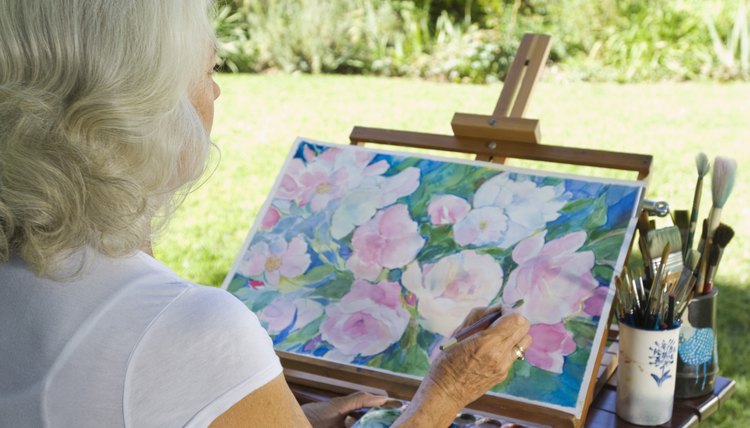Woman painting outdoors