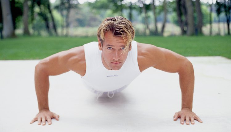 Muscular man making press-ups