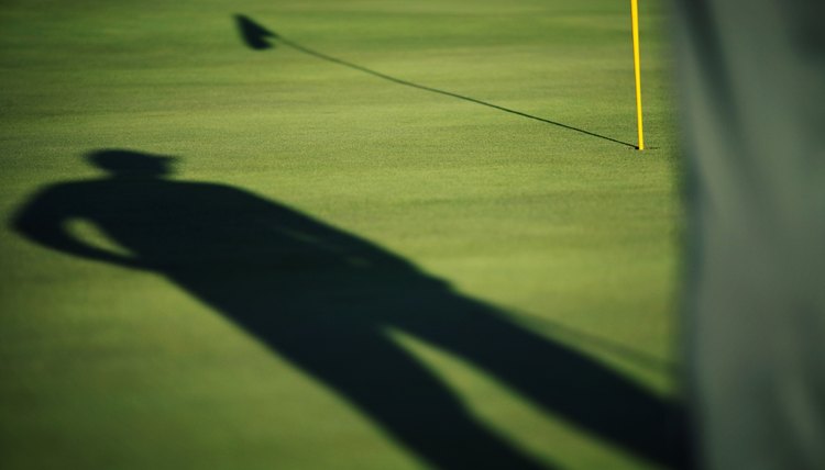 Golfer scopes putt