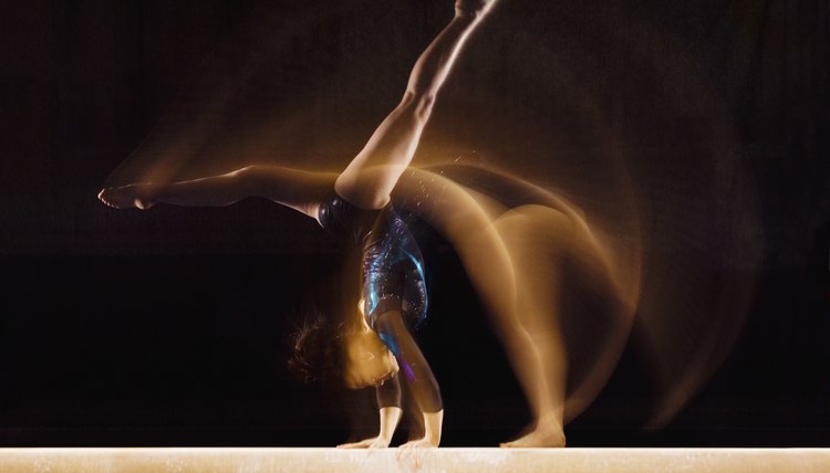 Gymnast Doing Cartwheel on Balance Beam