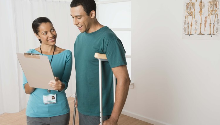 Physical therapist talking to patient