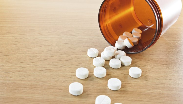 Pills spilling out of bottle