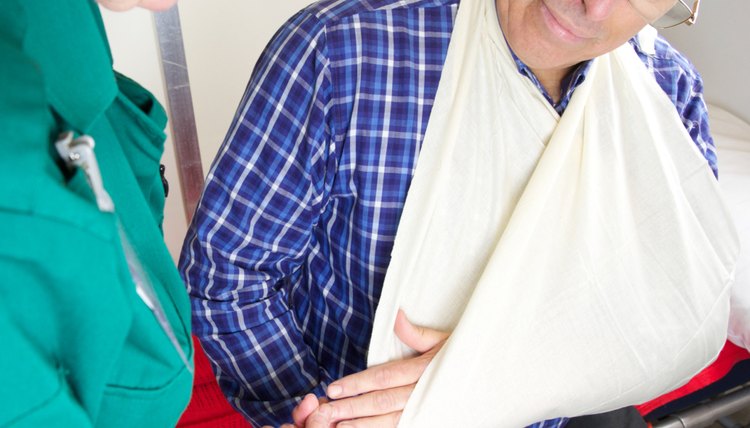 Patient being attended to by paramedic nurse for injured arm
