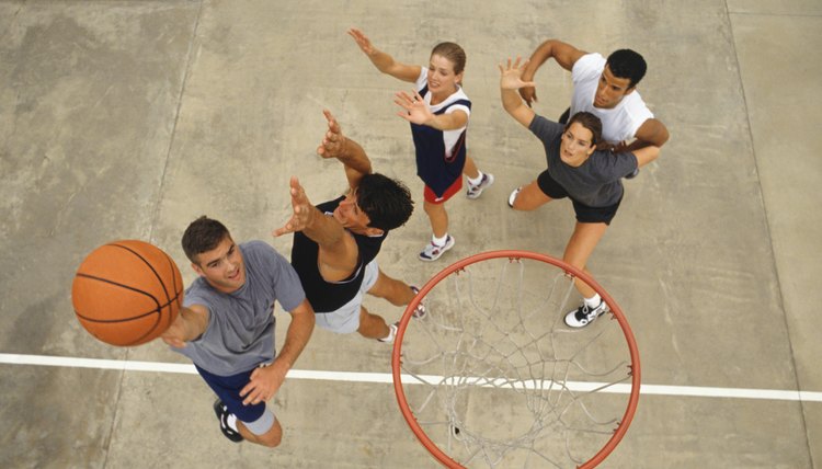 Group of young people playing basketball, elevated view