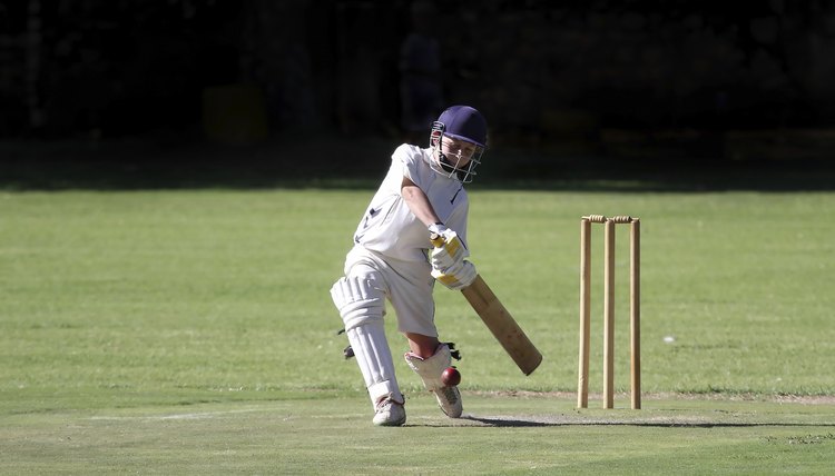Young boy playing cricket shot