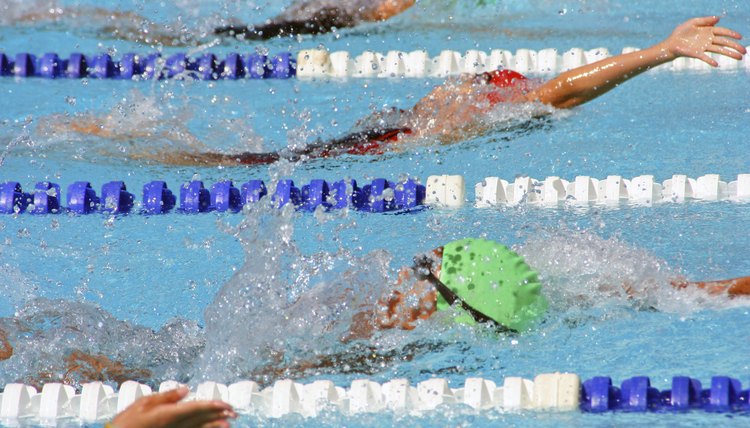 Backstroke swimmers in a close race