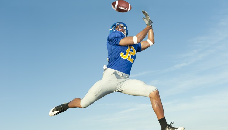 Football Player Catching a Ball