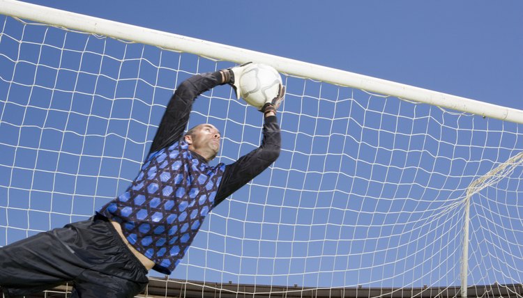 Goalie catching soccer ball