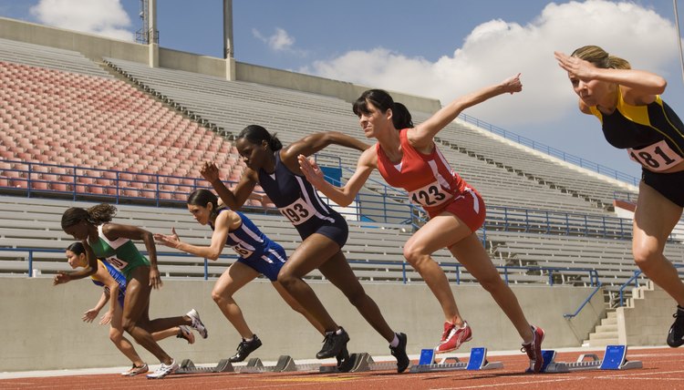Group of female track athletes sprinting
