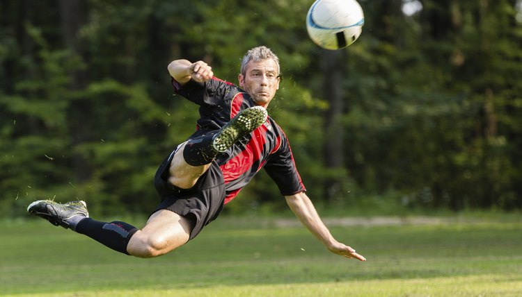 soccer player in a bicycle kick