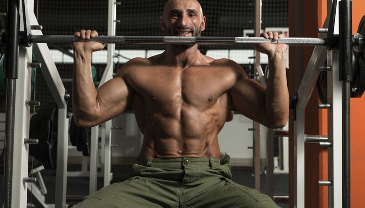 Healthy Mature Man Doing Exercise For Shoulder