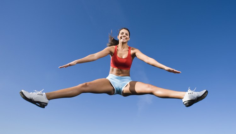 Native American woman jumping in mid-air