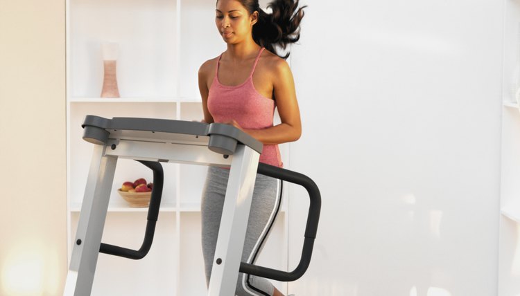Woman running on a treadmill at home