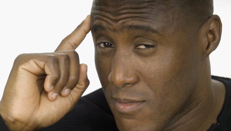 Portrait of a young man with a finger on his head