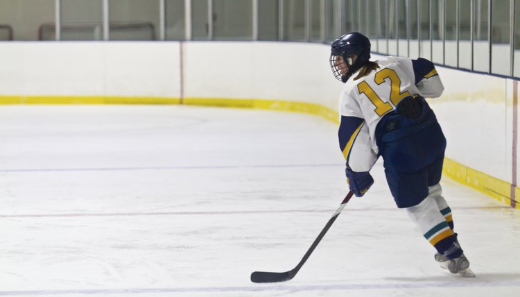 Female ice hockey player skating during a game