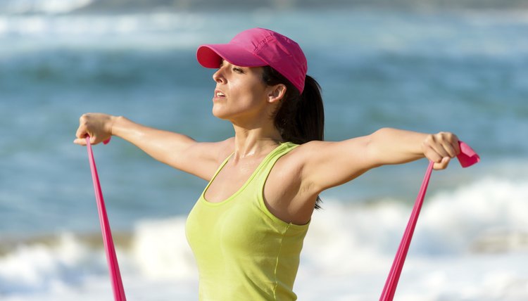Fitness woman training shoulders