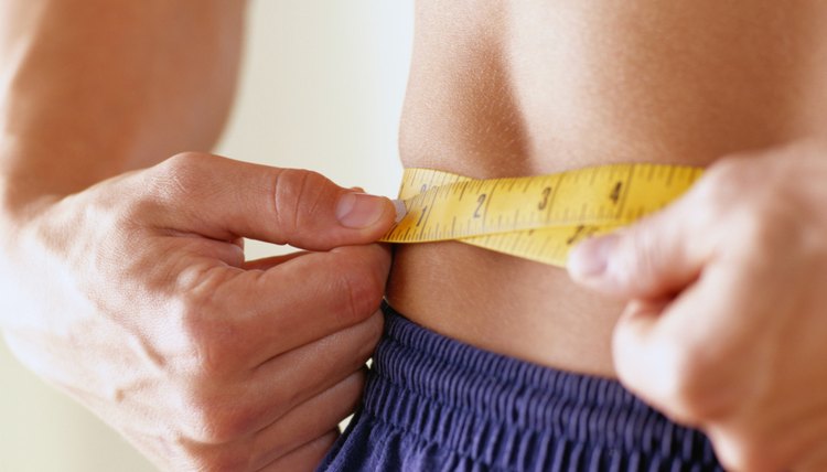 Close-Up of a Man Measuring His Waist