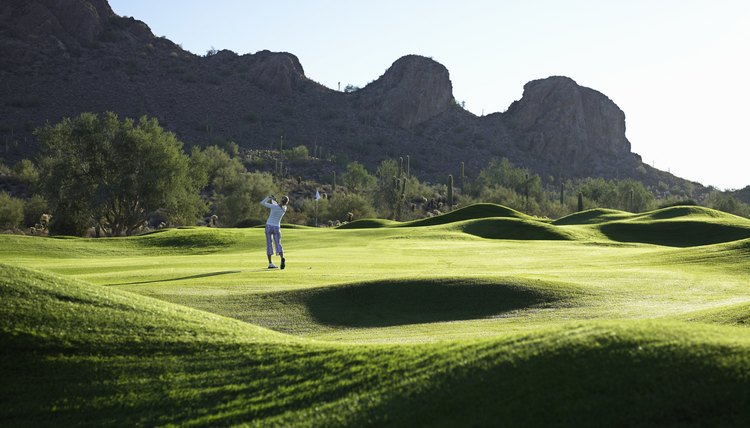 Man playing golf on course